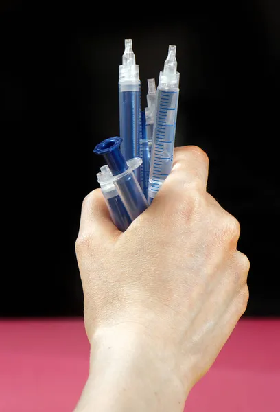 Female Holding Many Plastic Syringes Her Hand Black Background — Stock Photo, Image