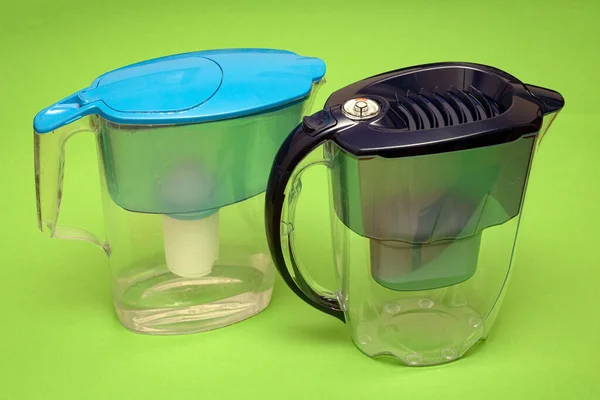 Plastic Jugs Water Filtering Home Green Background — Stock fotografie