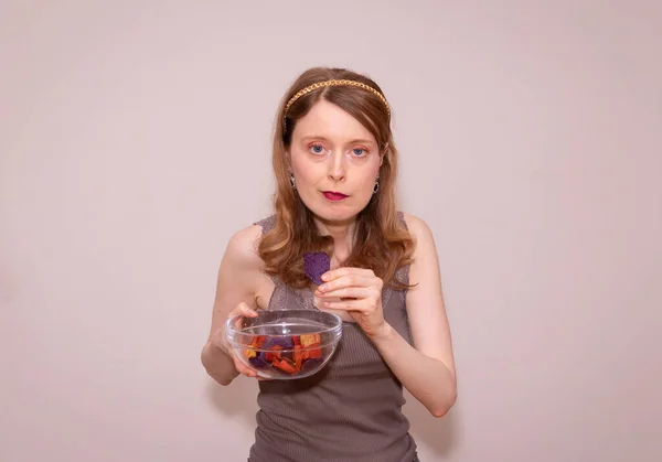 Young Beautiful Woman Holding Colorful Potato Chips Glass Transparent Bowl — Stock Photo, Image