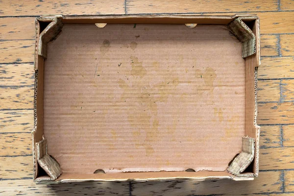 Empty Dirty Used Cardboard Box Wooden Floor — Stock Fotó