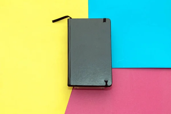 Black Leather Journal Notebook Diary Colorful Background — Zdjęcie stockowe