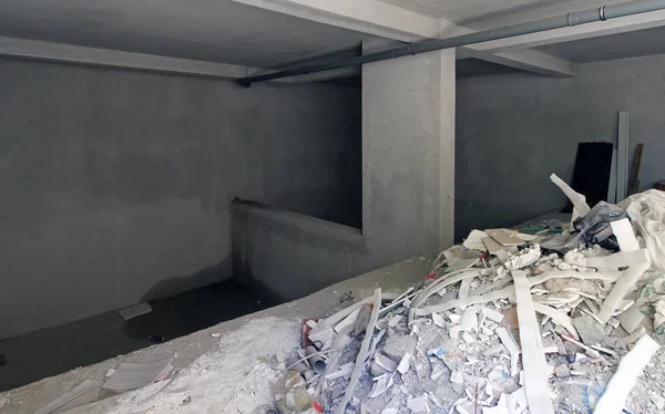 Empty unfinished house interior during messy construction works