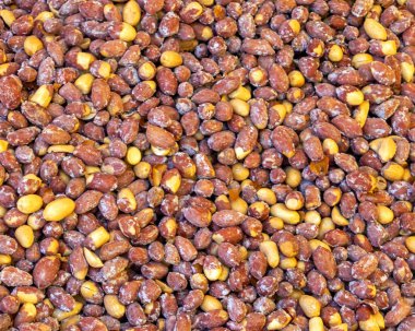 Background pile of fried and salted peanuts