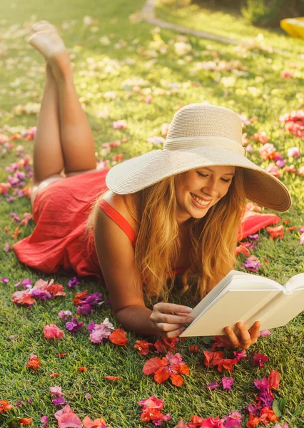 Young Woman Reading Book Outside Royalty Free Stock Photos