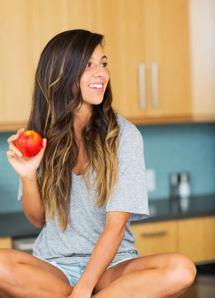 Beautiful woman with an apple — Stock Photo, Image