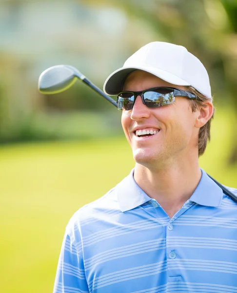 Athletic young man playing golf — Stock Photo, Image