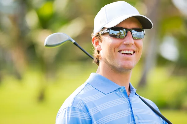 Athletic young man playing golf — Stock Photo, Image