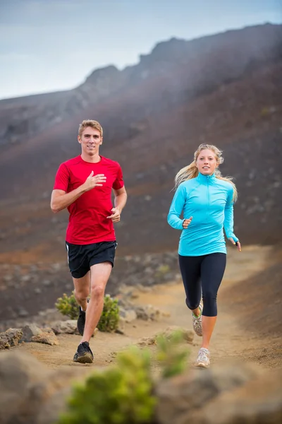 Fitness sport couple running jogging outside on trail — Stock Photo, Image
