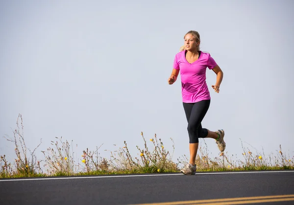 Athletic woman running jogging outside — Stock Photo, Image