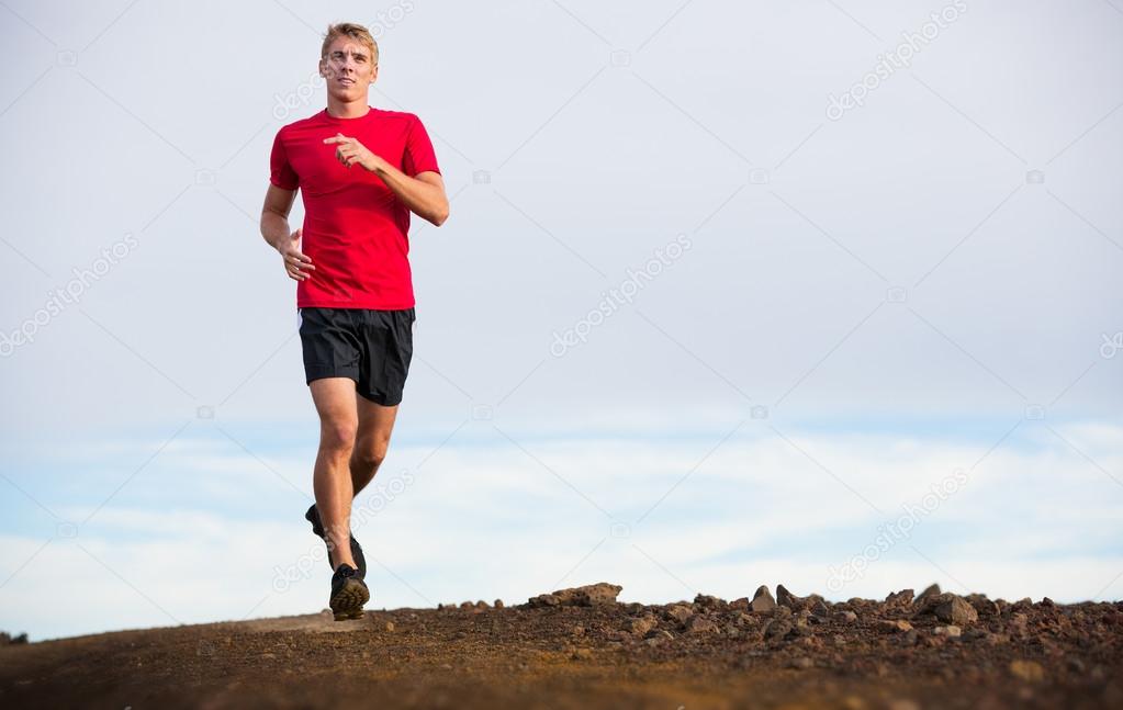 Athletic man running jogging outside, training