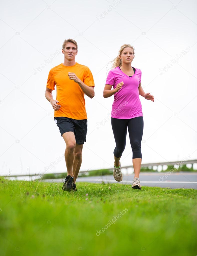 Fitness sport couple running jogging outside