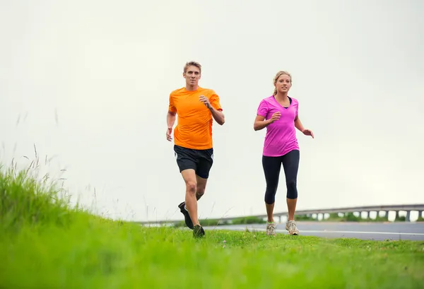 Fitness sport couple running jogging outside — Stock Photo, Image