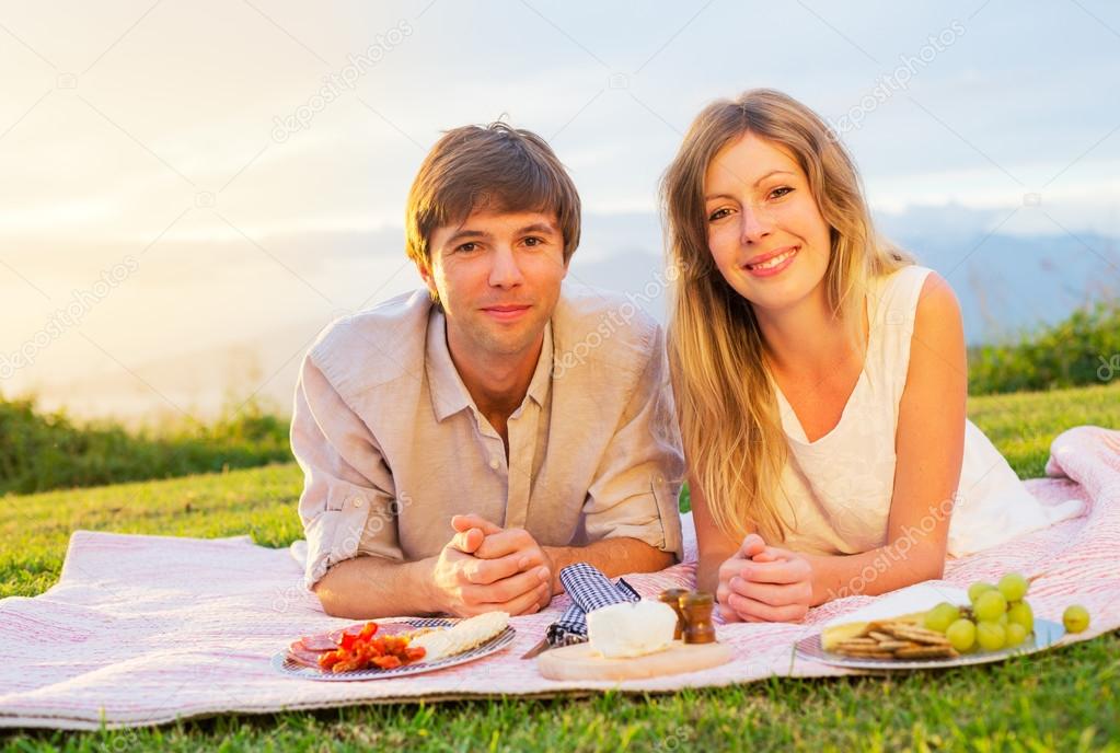 Couple Enjoying Romantic Sunset Picnic