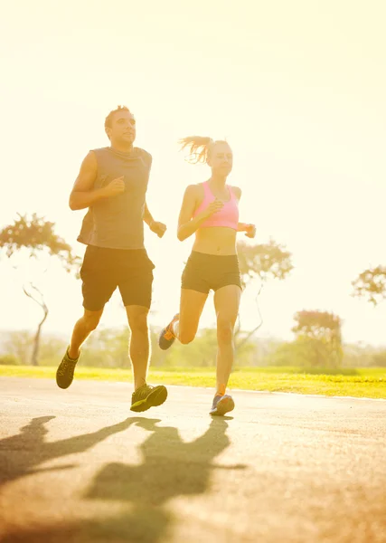 Couple running in park — Stock Photo, Image