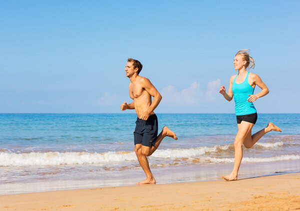 Couple running on the beach