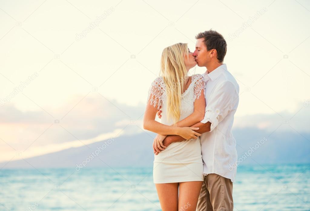 Couple Enjoying Sunset on the Beach