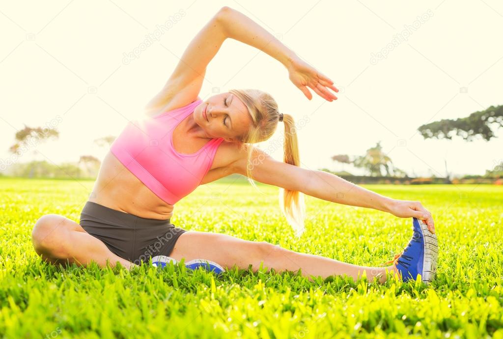 Young woman stretching before exercise