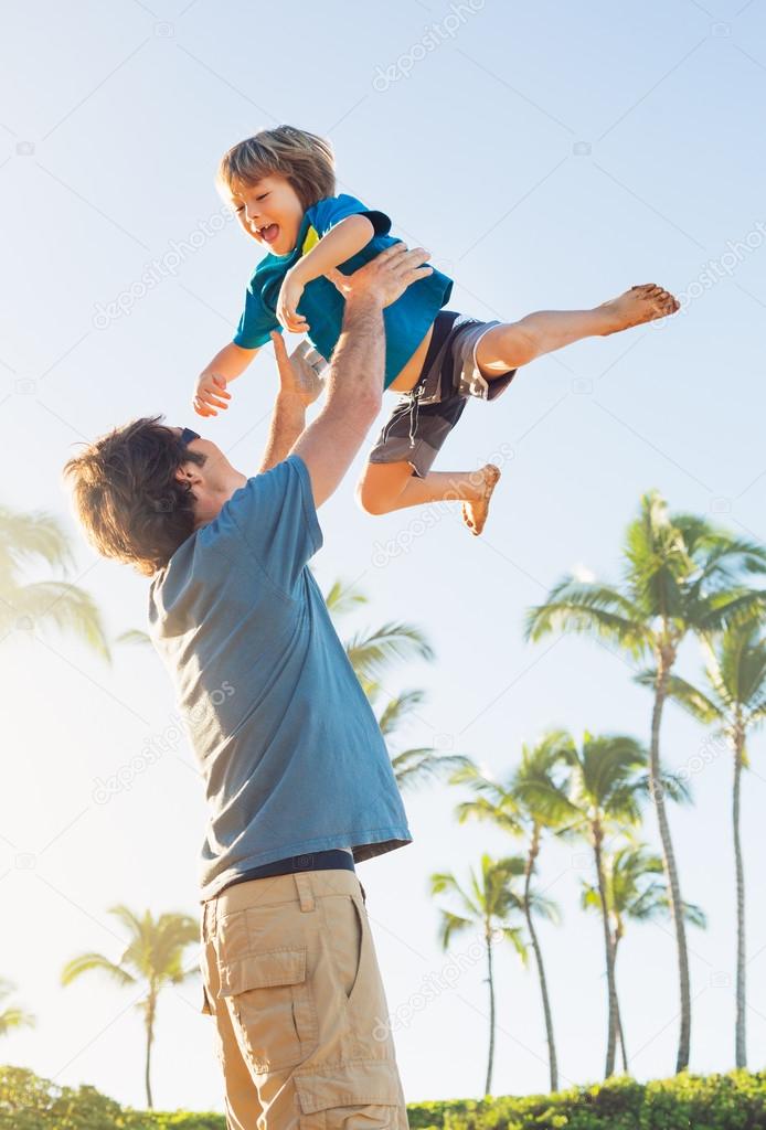 Happy father and son playing