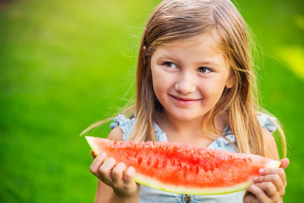 Girl eating watermelon — Stock Photo, Image