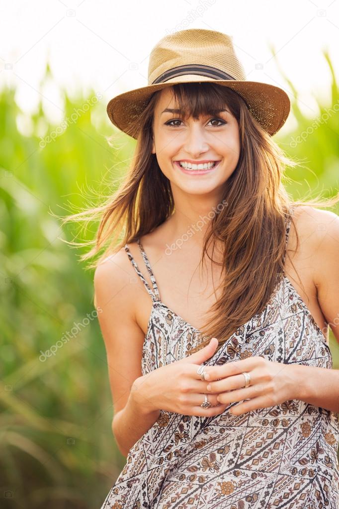 Beautiful Young Woman Outdoors in Sun Dress