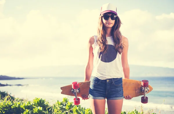 Hipster girl with skate board — Stockfoto