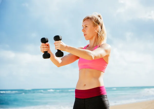 Fitness woman with barbells working out — Stock Photo, Image