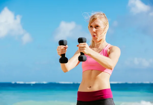 Fitness woman with barbells working out — Stock Photo, Image