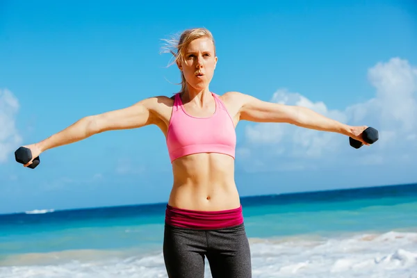 Fitness woman with barbells working out — Stock Photo, Image