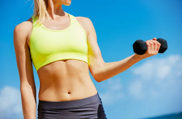 Fitness woman with barbells working out — Stock Photo, Image