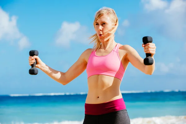 Fitness woman with barbells working out — Stock Photo, Image