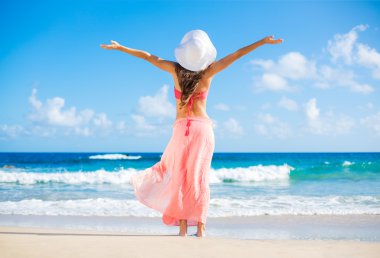 Happy woman at the beach clipart