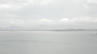 Phuket town from aerial view while raining from the sea bay. Tropical weather