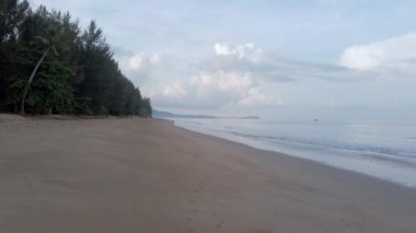 slow-motion natural sea wave water with foam on the sandy beauty white beach, summer beach seascape