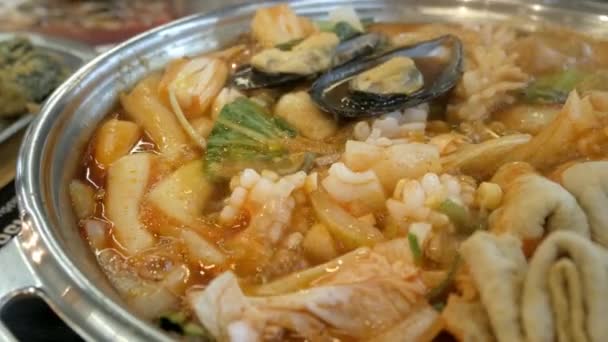 Close Boiling Korean Kimchi Tteok Pokki Soup Full Pork Squid — Stock Video