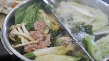 close up view to the hotpot shabu full view vegetable and mushroom. Asian food hotpot cooking