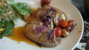 using fork to eat roasted duck with burry sauce