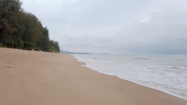 slowmotion natural sea wave water with foam on the sandy beauty white beach, summer beach seascape