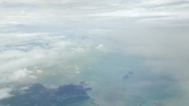 view of cloudy above the sky in daytime. cloudscape from fly airplane