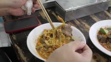 famous traditional khao soi in lana chiang mai yellow spicy taste noodle soup style. Local Thai style food