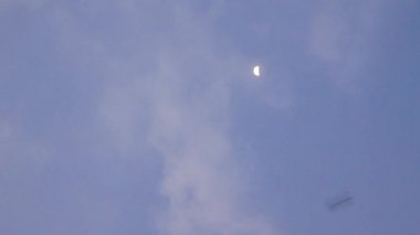 View to the sky with light cloudy and some light after sundown