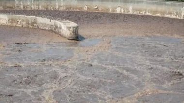POV to the water surface in treatment pond while in waste water treatment process. Waste water treatment,recycle,environment concept.