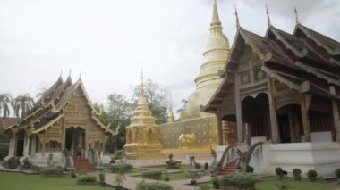 July 13,2022 :Chiangmai,Thailand:beautiful view of Wat Phra Singha temple with golden glow pagoda. Southeast asia life in Chiang Mai,Thailand.