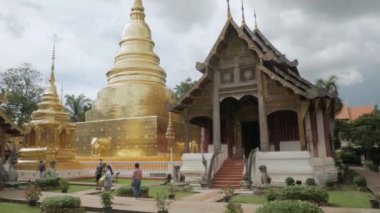 July 13,2022 :Chiangmai,Thailand:beautiful view of Wat Phra Singha temple with golden glow pagoda. Southeast asia life in Chiang Mai,Thailand.