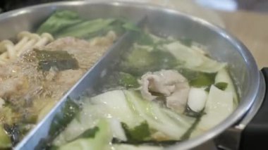 close up view to the hotpot shabu full view vegetable and mushroom. Asian food hotpot cooking