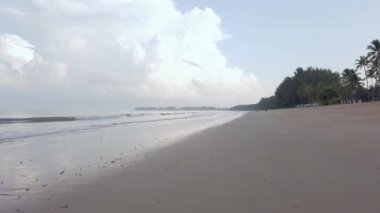 slow-motion natural sea wave water with foam on the sandy beauty white beach, summer beach seascape