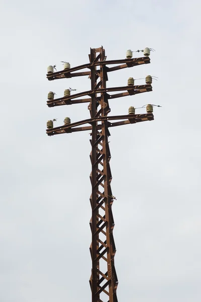 Old rusty electrical pole — Stock Photo, Image