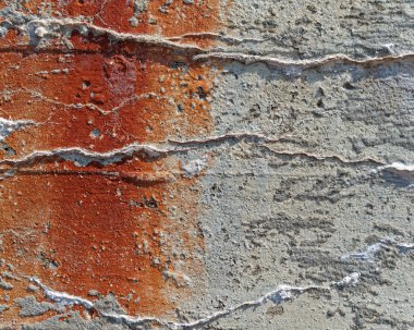 Close up of aged concert showing weathering and discoloration. 