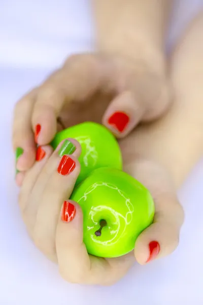 Green apples in hands — Stock Photo, Image