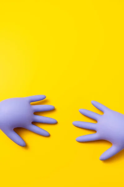 Great View Purple Inflated Latex Gloves Which Lie Vibrant Yellow 스톡 사진