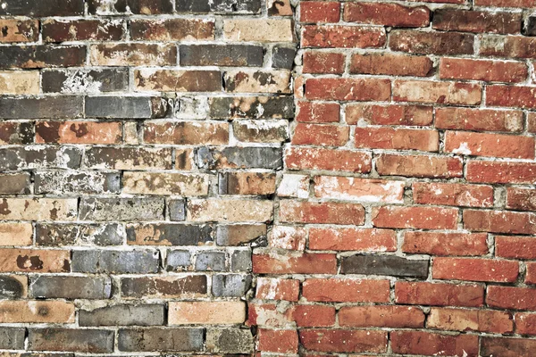 Half new and half old brick wall. — Stock Photo, Image
